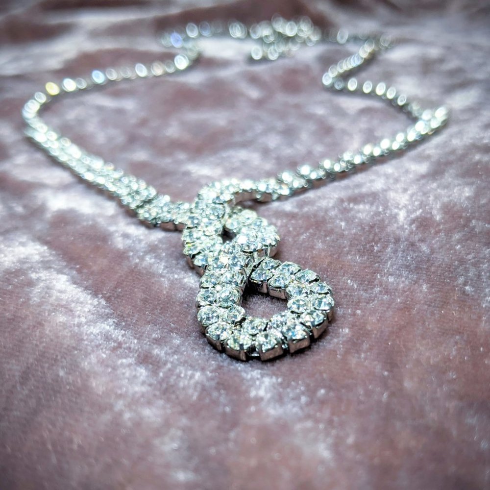 Long Infinity Knot Rhinestone Statement Necklace - Picture 9 of 9
